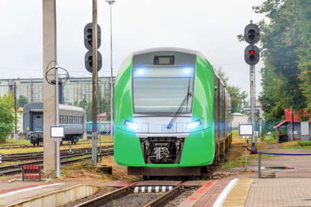 The commuter train leaves the passenger station