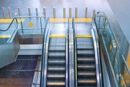 Two escalator stairs up and down to different floors of the building