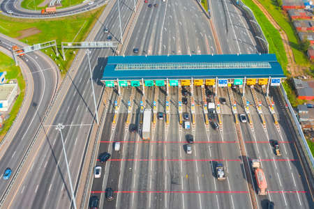 Top view aerial overloaded toll road or tollway on the controlled access highway, forced traffic jamの素材 [FY310157637706]