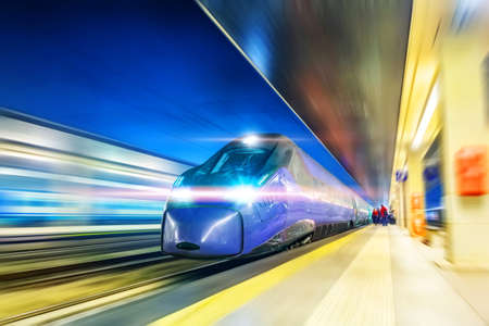 High speed midnight express rushes through the city night station