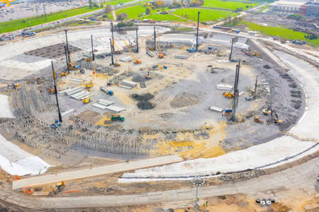 Construction of a stadium, exhibition complex, arena. Heavy machines for driving pillars work in...
