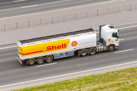 Heavy big fuel tanker truck Shell company on city highway. Russia, Saint-Petersburg. 16 june 2020のeditorial素材