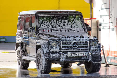 Mercedes-Benz G-Class Gelandewagen the car at the express car wash is covered with foam. Russia,...