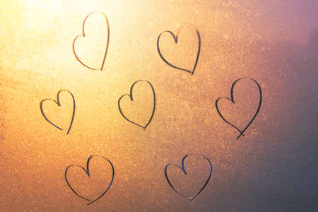 Several hearts by hand drawn on frozen glass, pattern. Love concept, Valentine's Dayの写真素材