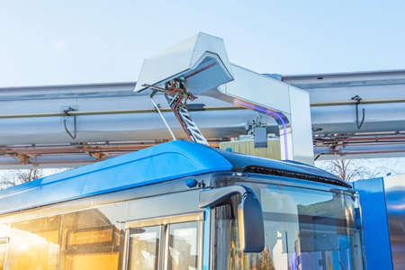 Device for recharging batteries on the roof of an environmentally friendly transport of a city bus, charging refueling, fuel stationの写真素材