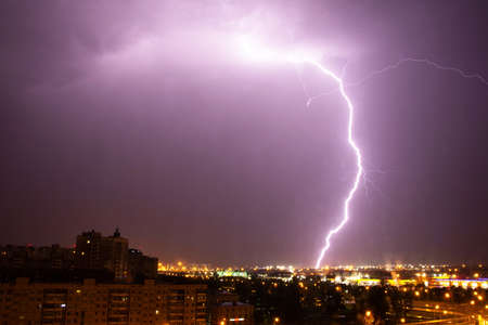 Lightning strike the ground in the city at night