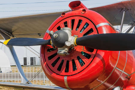 Propeller and engine of historical vintage red airplaneの写真素材