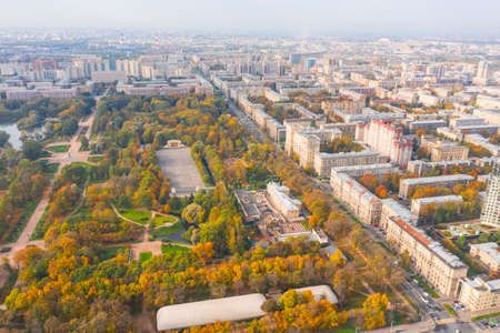 City autumn park among urban buildings, aerial viewの写真素材