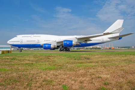 Huge plane taxiing on the taxiway at the airport