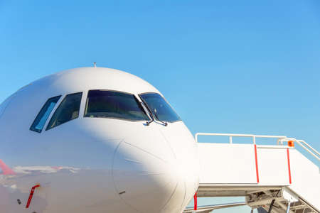 Commercial passenger aircraft, ready for boarding on the landing strip of an airport