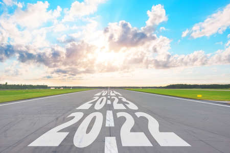 New Year 2022 Goals Concept. Empty asphalt road day clouds with text 2022, 2023, 2024