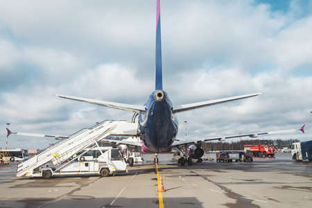 Passenger aircraft, waiting for the passengers to board at the airport terminal