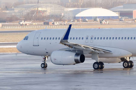 The plane is taxiing to the steering track before takeoff, close-up view