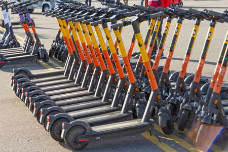 Whoosh quicksharing electric scooters are parked to row for rent. Russia, Sochi, 04 december 2021のeditorial素材