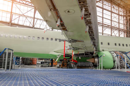 Maintenance and repair of a passenger aircraft wing. Wing flaps disassembled releasedの写真素材