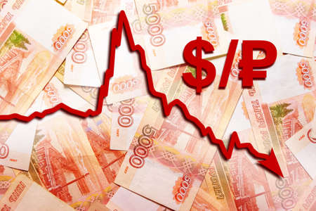 Graph of the depreciation of the dollar against the ruble against the background of five thousandth banknotesの写真素材