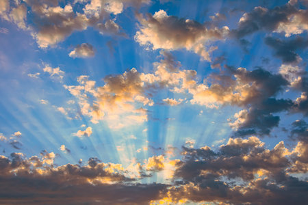 Beautiful rays of light and clouds. Divine sky, glow and shadows from dark clouds