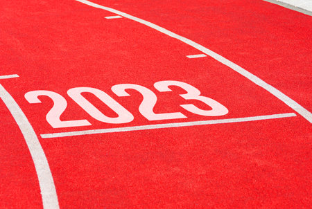 Red running track with new year 2023. Start concept of fresh beginnings, bright future, new lifeの写真素材