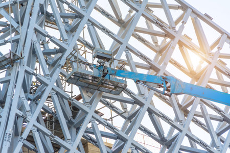 Metal frame lattice building decoration, with tower lift and cradleの写真素材