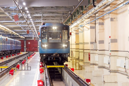 Electric locomotive metro subway with headlights on arrived at the depot. Passenger trains arriving for service at the electric depotの写真素材