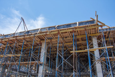 Wooden formwork for the base of the walls and supports, supported by metal supportsの写真素材