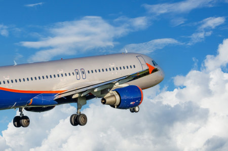 Airliner jet plane take off in the air on cloudscape background.