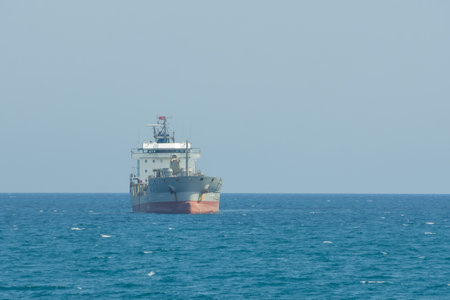 Front side view of oil tanker ship sailing on open sea.の写真素材