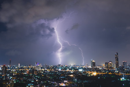 Lightning storm over night city.の写真素材