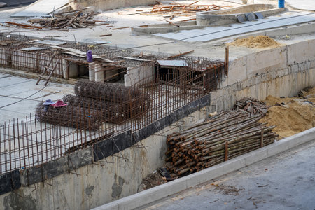 Construction site with foundation pit for monolithic reinforced skyscraper. Monolithic slab foundation and concrete pouringの写真素材