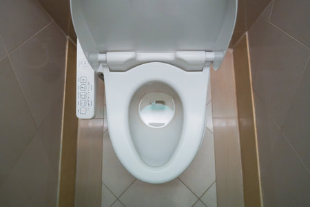 High Tech toilet with automatic bidet installed in public restroom.の写真素材