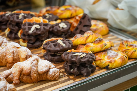 Viennese Waffle with chocolate topping in a bakery window.の写真素材