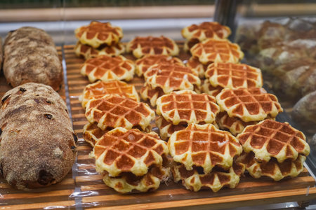 Viennese waffle delicious fresh dessert in a cafe on the street, in a bakery window.