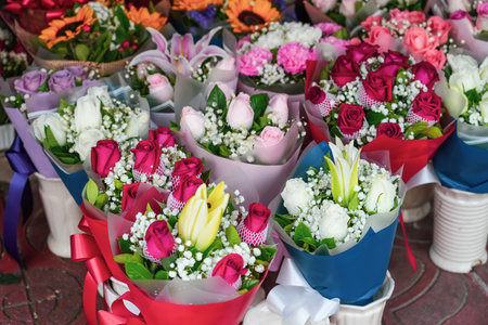Many lot bouquets compositions of flowers of various colored yellow red pink and white shades of chrysanthemum rose carnation flowersの写真素材