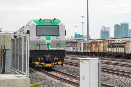Electric locomotive at a charging station next to the train depotの写真素材