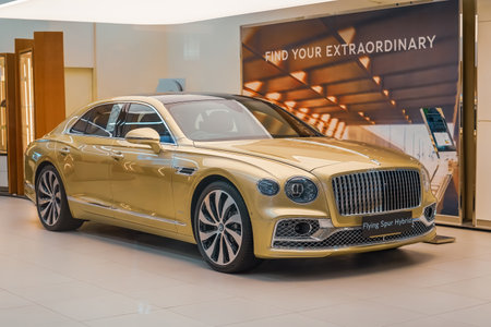 Gold Bentley Flying Spur Azure Hybrid, sustainable energy, Mulliner Driving Specification. Luxury...