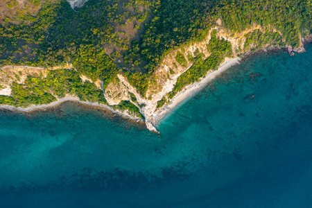 Aerial view of sea waves fantastic wild rocky coastの写真素材