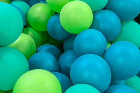 Green blue rubber inflatable balloons close up texture.の写真素材