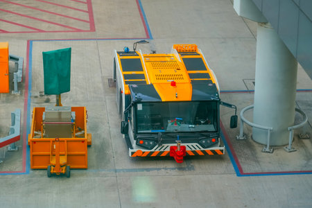 Tug tow truck tractor parking lot on the airport tarmac.の写真素材