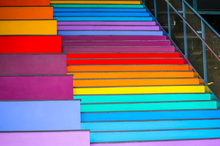 Colorful stairs and colorful wall background, different heights of steps.の写真素材