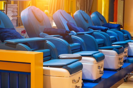 Comfortable soft massage blue chairs for clients with a ottoman for foot massage and other...