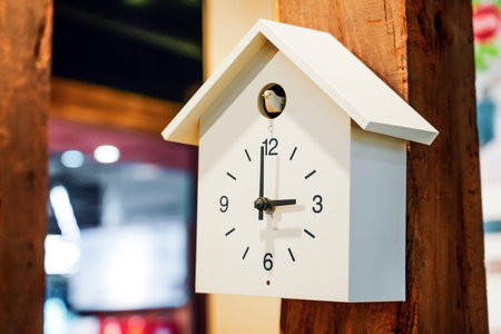 White Cuckoo clock on a wooden pillar support wallの写真素材