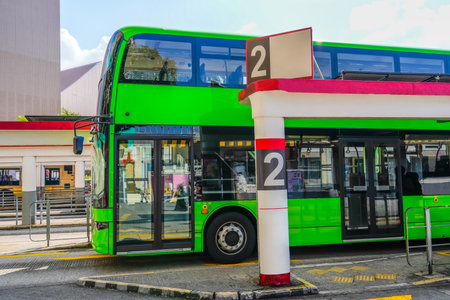 Green Double Decker Bus the final bus station, waiting for passengers, ready to start depart on the route number 2 two.の写真素材