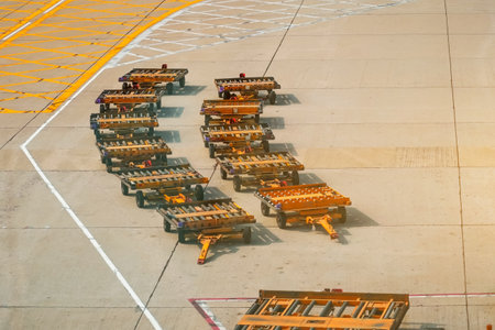 airport luggage carts in the parking lot.の写真素材