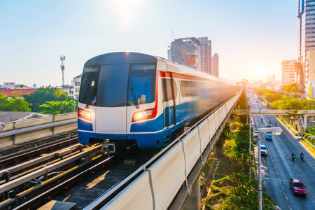 Electric train motion blur effect railway carriage rushes turn travels along route in sunset sky...