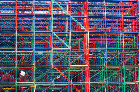 Scaffolding red blue on a construction site of a new building.の写真素材