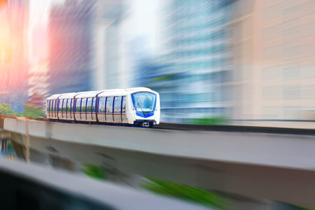 Subway high speed passenger train ride bridge at the station, blurry speed effect. Concept of modern comfortable fast passenger transportation in the region.の写真素材