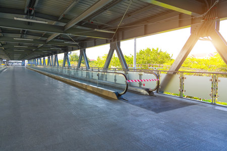 Passage is prohibited on a travellator, an elevated pedestrian crossing at the airport, railway stationの写真素材