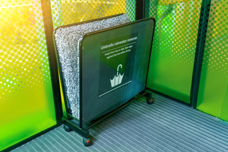 Umbrella drying rack at the entrance to a public establishment, for visitors with wet umbrellas, storage and drying space.の写真素材