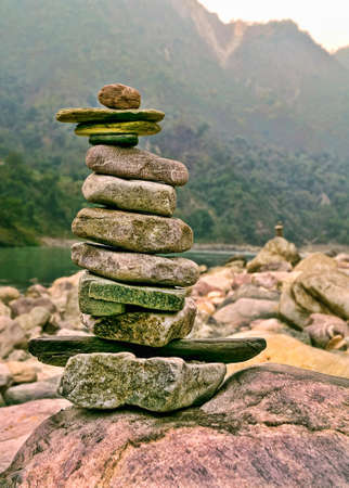 Stack of disfigured pebbles in Stable Equilibrium