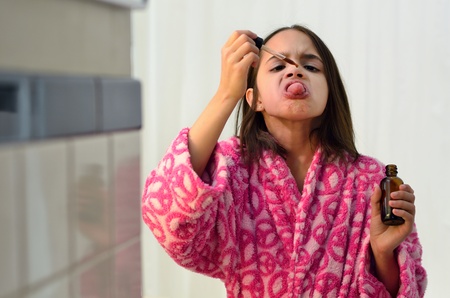 Little Hispanic Girl Taking Medicineの写真素材